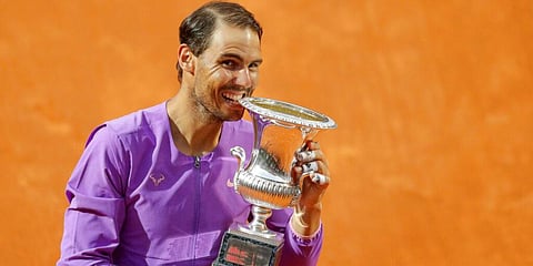 Spain's Rafael Nadal celebrates with the trophy after winning the Italian Open tennis tournament, in Rome. (Photo | AP)