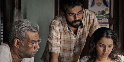A still from 'Aarkkariyam'.