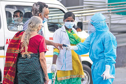 A nurse seen reading vitals of a Covid patient at RGGGH in Chennai on Tuesday | debadatta mallick