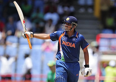 Suresh Raina (R) celebrates after scoring a century during the ICC World Twenty20 Group C match between India and South Africa. (Photo | AFP)