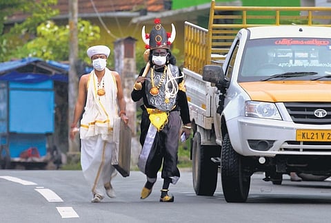 Artists in the role of Lord Yamadeva and Chitragupta prepare for the prank video for creating Covid awareness 