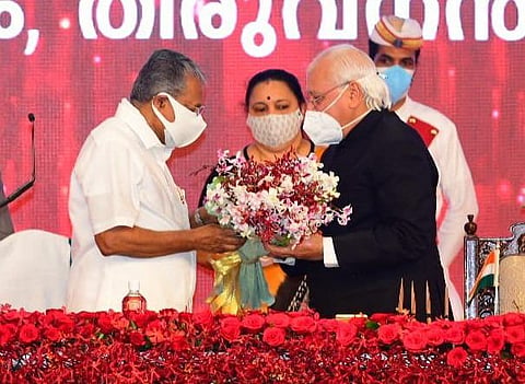 Governor Arif Mohammad Khan greets Chief Minister Pinarayi Vijayan after the latter was sworn in at Central Stadium in Thiruvananthapuram on Thursday (Photo | PRD)