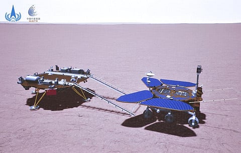 In this artist's rendering made available by the China National Space Administration (CNSA) on Saturday, May 22, 2021, China's Zhurong rover is depicted on the surface of Mars. (Photo | AP)