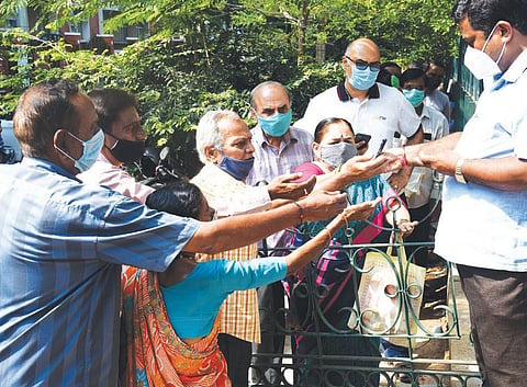 Tokens being distributed for vaccination (Photo | Vinod kumar.T, EPS)