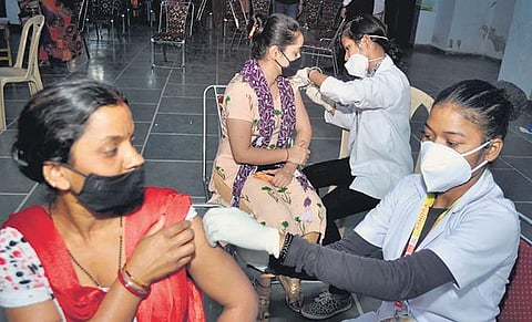 A health worker administers a vaccine to a beneficiary at a school in Patiala | pti