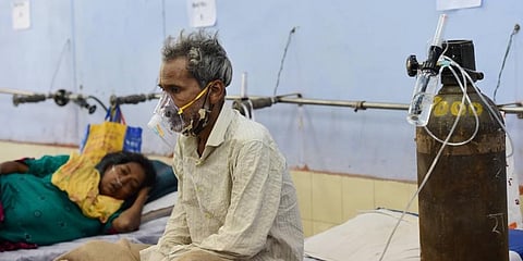 COVID-19 positive patients recover at a makeshift hospital in Ghaziabad, Monday. (Photo | PTI)