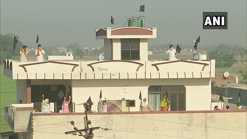 People put up black flags at their houses in Amritsar  as the farmers protesting against the Farm Laws, observe 'Black Day'.