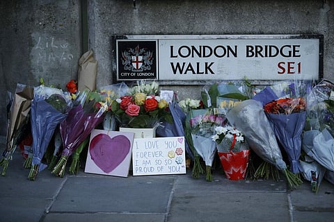 Tributes are placed by the southern end of London Bridge, three days after a man stabbed two people to death and injured three others (Photo | AP)