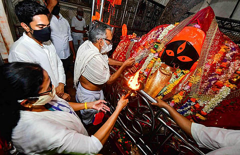 TMC supremo and West Bengal Chief Minister Mamata Banerjee visit Kalighat Temple after trends show her party's win in the State Assembly Election 2021, in Kolkata. (Photo | PTI)