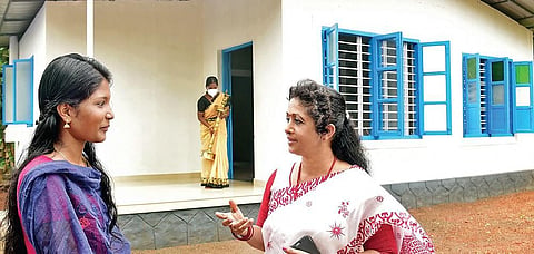 Sunil M S talks to medical student  Sreelakshmi in front of the new house constructed for the latter | Shaji Vettipuram