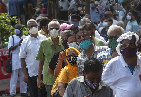 People queue up for COVID-19 vaccine in Mumbai in this file photo. (Photo | AP)
