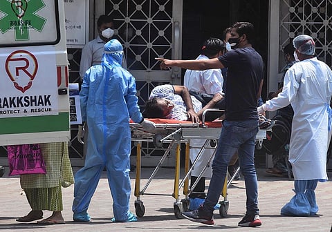 A patient suffering from Covid-19 seen on a stretcher at LNJP Hospital in Delhi. (File Photo | Parveen Negi, EPS)
