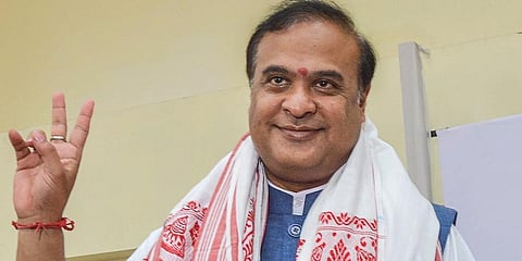 BJP's Chief Minister designate Himanta Biswa Sarma flashes victory signs after being elected party's Legislative party leader in Guwahati. (Photo | PTI)