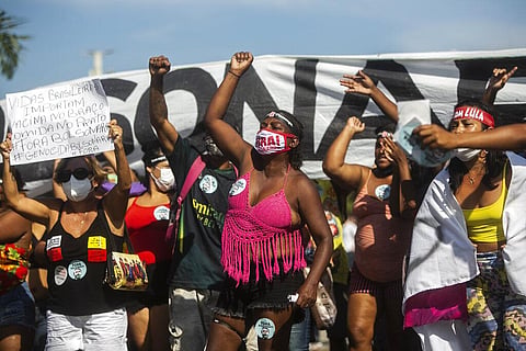 Demonstrators shouts slogans during a protest against the government's response in combating COVID-19. (Photo | AP)