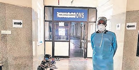 A man in protective gear outside the isolation ward at Gandhi Hospital. (File Photo | EPS)