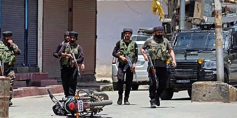 Army soldiers rush near the spot after the militants opened fire at a police party at the main chowk, Sopore, in Baramulla on Saturday. (Photo | ANI)