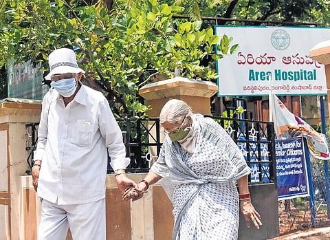An elderly couple leaves the Area Hospital in Vanasthalipuram on Thursday after taking the vaccine. (File photo | EPS/VINAY MADAPU)