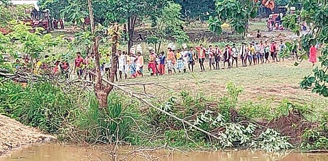 Villagers withdraw from the protest site on Saturday. (Photo| EPS)