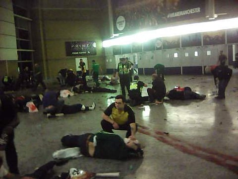 Helpers attend to injured people inside the Manchester Arena, Manchester, Britain, after a blast on May 22, 2017. (File Photo | AP)