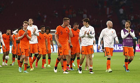 Netherlands' players celebrate at the end of the Euro 2020 soccer championship group C match between Netherlands and Austria. (Photo | AP)