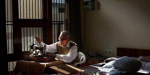 Sameer Saran's photo of his father using a sewing machine. (Photo| Instagram)