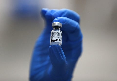 A nurse holds a phial of the Pfizer-BioNTech COVID-19 vaccine . (Photo | AP)