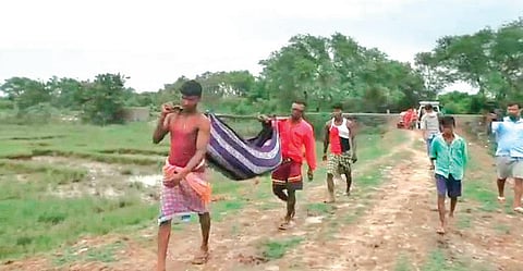 Narottam’s body being carried by villagers to Jungalagheri village | Express