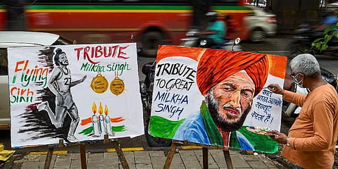 An art teacher draws a painting of Indian athelete Milkha Singh as a tribute after he died following post COVID complications, in Mumbai, Saturday, June 19, 2021. (Photo | PTI)