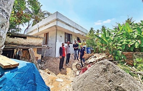 Nibun and team during construction of the new house. 
