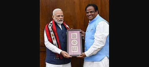 BJP leader and former Union minister John Barla with Prime Minister Narendra Modi. 