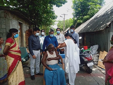 The Tiruvallur District Collectorate vaccinating Narikuravar tribals near Redhills (Photo | Special arrangement)