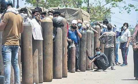 People wait to refill oxygen cylinders during the peak of Covid second wave | PTI FILE