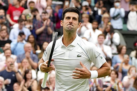 Serbia's Novak Djokovic celebrates winning the men's singles match against Britain's Jack Draper on day one of the Wimbledon Tennis Championships. (Photo | AP)