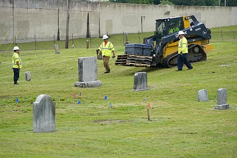 Workers bring equipment to the site where excavation will take place at Oaklawn Cemetery in a search for victims of the Tulsa Race Massacre believed to be buried in a mass grave (Photo | AP)