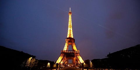 The Eiffel Tower is illuminated in Paris. (Photo | AP)