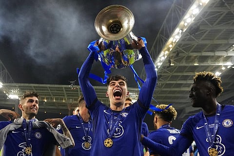 Chelsea's Kai Havertz celebrates with the trophy after winning the Champions League final soccer match between Manchester City and Chelsea. (Photo | AP)