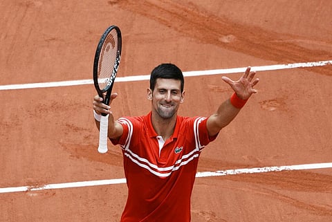 Serbia's Novak Djokovic celebrates towards the crowd after defeating Lithuania's Ricardas Berankis during their third round match on day 7, of the French Open. (Photo | AP)