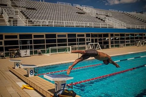 Syrian refugee Ibrahim al-Hussein takes part in a training session at the Olympic Aquatic Centre in Athens, on June 2, 2021. (Photo | AFP)