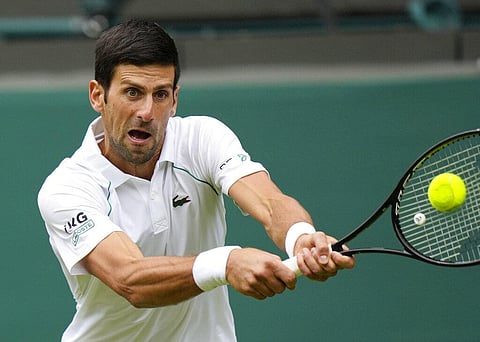 Serbia's Novak Djokovic plays a return to South Africa's Kevin Anderson during the men's singles second round match on day three of the Wimbledon Tennis Championships. (Photo | AP)