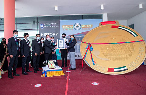 Symbols of the UAE such as the national flag and iconic landmarks of Abu Dhabi are engraved in the medal.