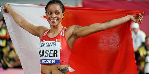 Salwa Eid Naser of Bahrain, celebrates after winning gold in the women's 400 meter final at the World Athletics Championships in Doha. (File Photo | AP)