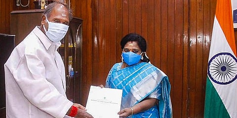 CM N. Rangasamy hands over a list recommending allocation of portfolios to five ministers newly inducted in his cabinet to Lt Governor Tamilisai Soundararajan. (Photo | PTI)
