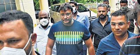 Sandalwood actor Darshan Thoogudeepa along with producer Umapathy Srinivas arrive at the ACP’s office in Mysuru on Sunday | udayshankar S