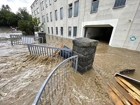 Water runs through the community after heavy rains, some of which flooded in Seblitz, Germany (Photo | EPS)