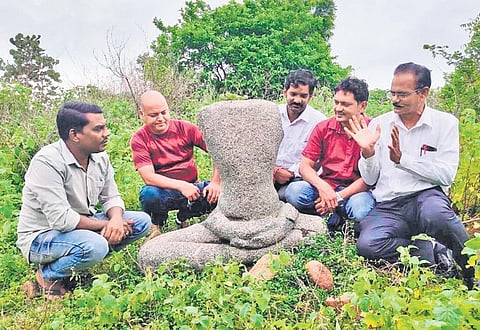 Members of the Kotha Telangana Charithra Brundam and archaeologist and Buddhist studies expert Dr E Sivanagi Reddy with the Mahavira sculpture.