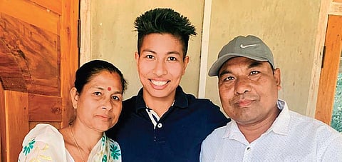Boxer Lovlina Borgohain (centre) with her parents