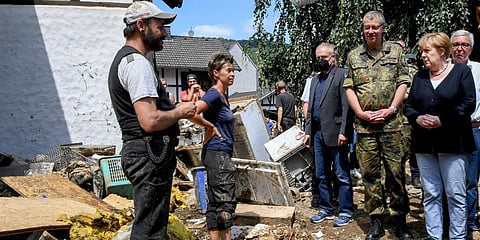Chancellor Angela Merkel talks to residents of flood-ravaged areas in Schuld, western Germany. (Photo| AP)