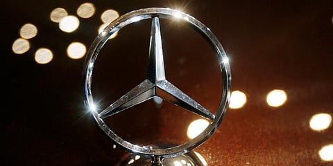 Llogo of a Mercedes car is photographed. (Photo | AP)