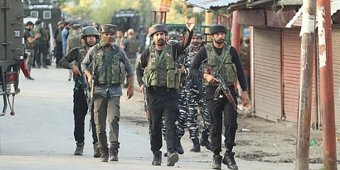 Security forces personnel during a encounter with militants in Warpora area of Sopore in north Kashmir's Baramulla district . (Photo | AP)