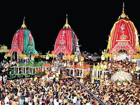 Servitors take Lord Jagannath from his chariot to the Ratna Singhasana in Goti Pahandi procession during Niladri Bije in Puri. (Photo | Ranjan Ganguly)